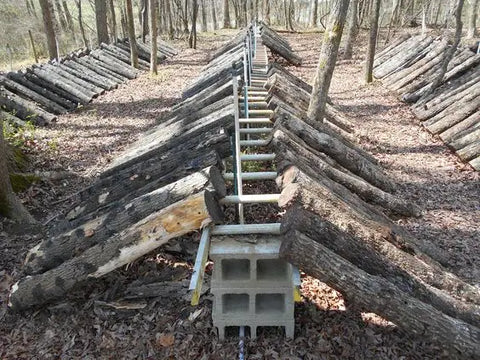 Wooden fortification with central ladder in zero-waste living article.