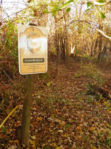 Grant Recipient Sign in Wooded Area for Luna Herb Co. & The Smelly Gypsy Ethical Remedies